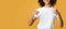 Cropped smiling young african american woman with curly hair in white t-shirt showing thumbs up