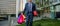 cropped successful man in formalwear with shopping bags and present box outside the office, bonus