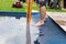 Cropped view of barefoot person wading in pool