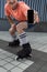 Cropped view of blurred roller skater