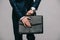 Cropped view of businessman opening briefcase isolated