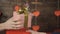 Cropped view of couple clinking wineglasses and echanging presents in valentine day