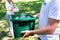 cropped view of couple of volunteers with recycling box