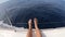 Cropped view of male legs on yacht in Atlantic ocean, Gran Canaria, Spain