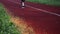 Cropped view of man running on running track