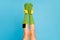 Cropped view of nice attractive lovely long legs wearing cozy comfortable mint green brandy socks with mp3 player put