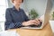 Cropped view portrait of attractive serious focused skilled girl specialist typing writing text data at work place