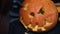 Cropped view of process of carving pumpkin for halloween at home