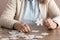 cropped view of retired woman with alzheimer holding puzzle piece.