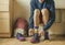 Cropped view of sportsman hands tie shoelaces of sneakers at the locker room i