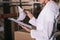 Cropped view of storekeeper holding clipboard