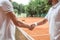 cropped view of tennis players shaking hands after game
