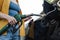 Cropped view of woman holding fueling