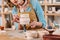 cropped view of woman painting ceramic jug