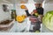 Cropped view of woman taking ripe fruits from refrigerator with food