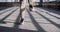 Cropped woman dancing on sunlit floor