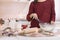 Cropped woman making dough for Christmas cookies