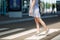 Cropped Young traveler tourist woman in light clothes with backpack standing on crosswalk at international airport