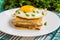 Croque-Madame, a French sandwich with greens and berry juice for breakfast. Wooden table. Top view. Close-up