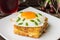 Croque-Madame, a French sandwich with greens and berry juice for breakfast. Wooden table. Top view. Close-up