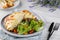 CROQUE MONSIEUR sandwichwith salad, tomato cherry and garlic bread served in a dish isolated on table side view of arabian