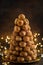 Croquembouche, festive profiteroles cake with caramel for Christmas