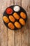 Croquetas de Bacalao Spanish Salt Cod Tapas with sauces close up in the slate plate. Vertical top view