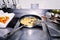 Croquettes frying in the pan in industrial kitchen