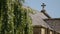 A cross above an old church