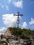 The cross on the background of clear sky at the top Biaklo (or M