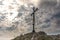 The cross on the background of clear sky at the top Biaklo or Maly Giewont near Olsztyn near Czestochowa