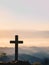 Cross on blurred mountain natural background