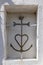 Cross of Camargue displayed on a building in Saintes-Maries-de-la-Mer