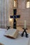 Cross, candles and scripture on the table in the Lutheran Church of the Redeemer on Muristan street in the Old City in Jerusalem,