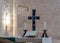 Cross, candles and scripture on the table in the Lutheran Church of the Redeemer on Muristan street in the Old City in Jerusalem,