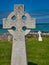 A cross in a coastal graveyard on the island of Eriskay in the Outer Hebrides, Scotland, UK. Taken on a clear, calm day in summer