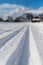 Cross-country skiing in Austria: Slope, fresh white powder snow and mountains, blurry background