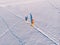 Cross-country skiing on track with dog malamute. Concept winter holiday. Aerial top view