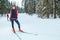 Cross-country skiing woman doing classic nordic cross country