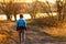 Cross-country trail running people at sunset. Runner couple exercising outside as part of healthy lifestyle.