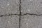 Cross crack on asphalt rough surface background