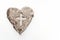 Cross or crucifix in heart symbol made of ash, lent and Ash Wednesday concept