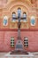 Cross with a crucifix near the wall of the Cathedral of the Life-Giving Trinity