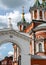 Cross-driven cathedral in Kolomna Kremlin from red bricks with golden domes and crosses. Russian Orthodox Church