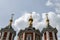 Cross-driven cathedral in Kolomna Kremlin from red bricks with golden domes. Russian Orthodox Church