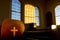 Cross on end of pew in historic chapel