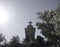 Cross on grave silhouette on cemetery. Halloween, Day of the dead, all Saint`s Day or Christianity concept