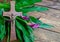 Cross with jesus christ on a wooden background with a purple calla - religious easter lent concept