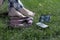 Cross legged women barefoot her shoes and tablet