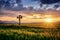 cross with the Lord Jesus Christ in the field at sunset near the Slovak village Hybe